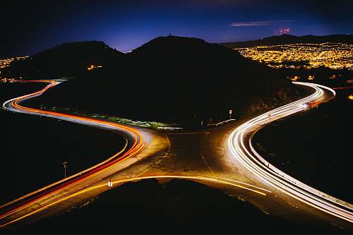san francisco aerial view photography of cross road near mountain during nighttime city